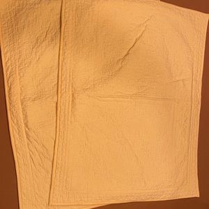 2 standard sized yellow shams